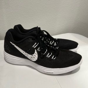 Nike women’s running shoe, black with white lettering, size 9